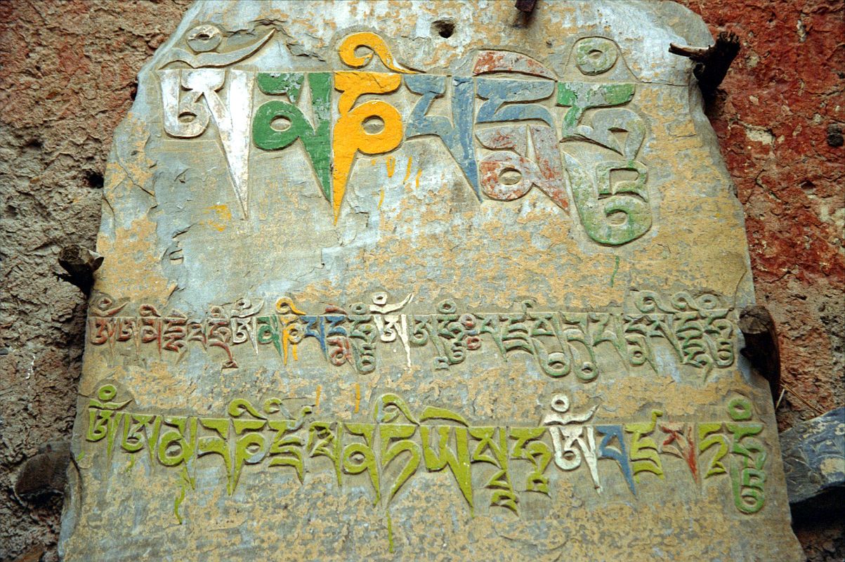 207 Kagbeni Mani Stone The ancient Bon religion gave way to Buddhism, symbolized by this mani stone in Kagbeni, with the most famous mantra Om Mani Padme Hum.